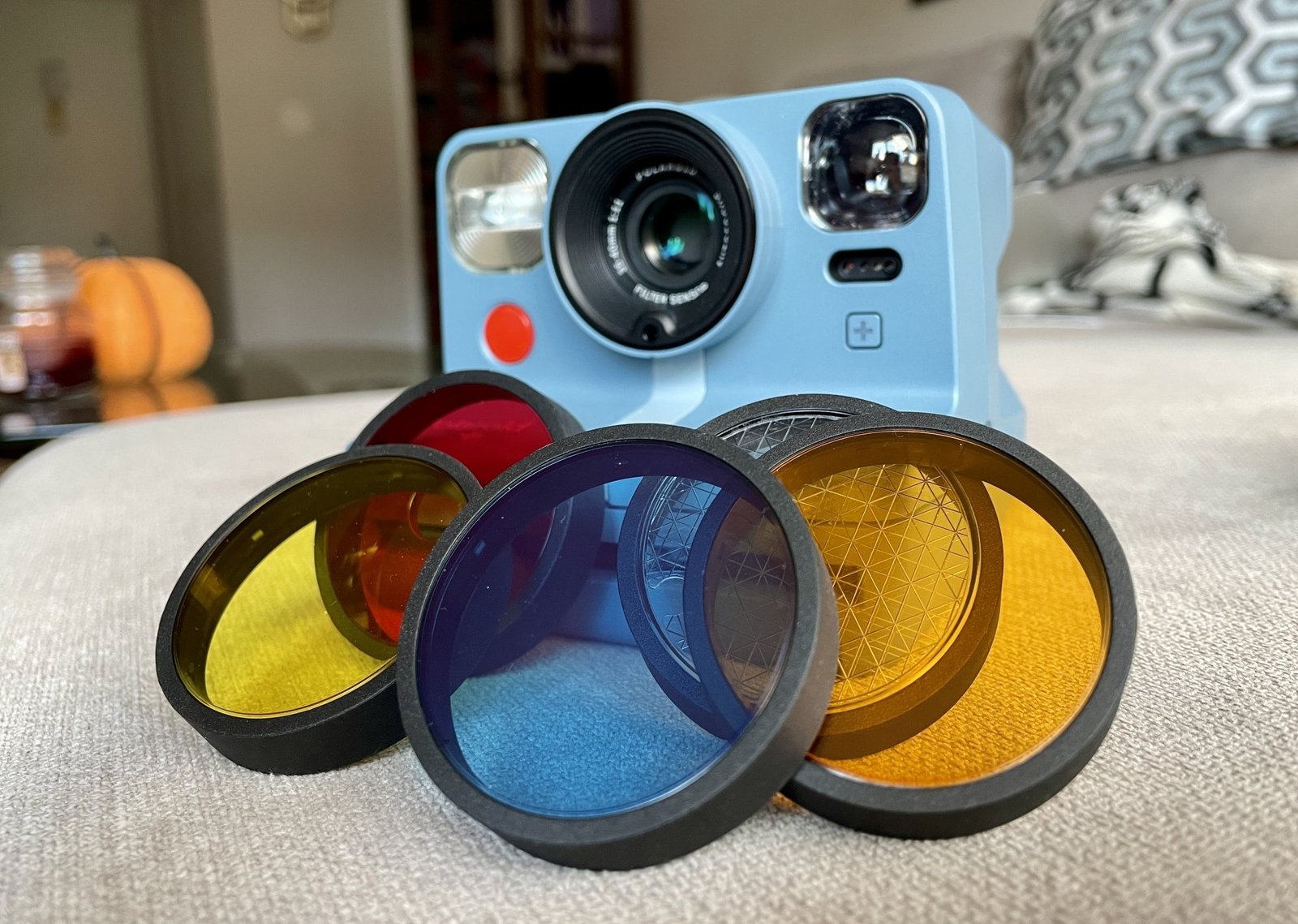 camera with red, yellow, blue, and orange lens filters